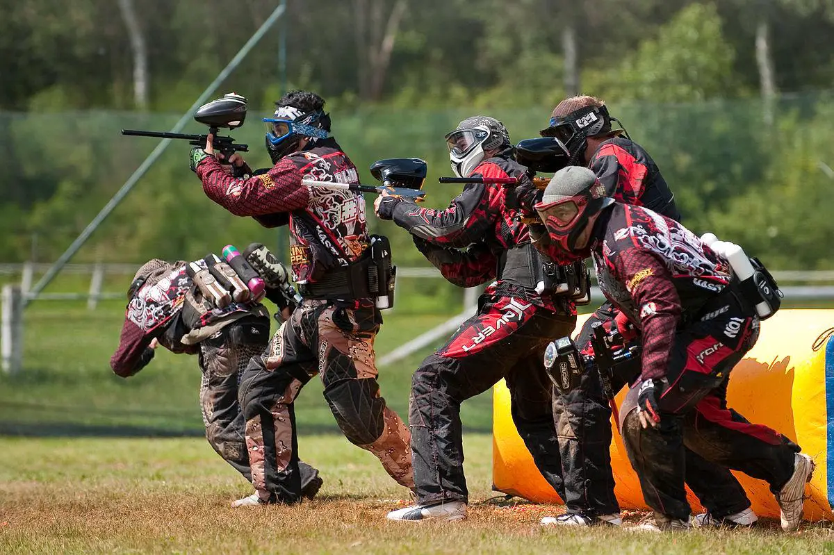 Collage of paintball players demonstrating various physical skills like sprinting, ducking, and precise aiming